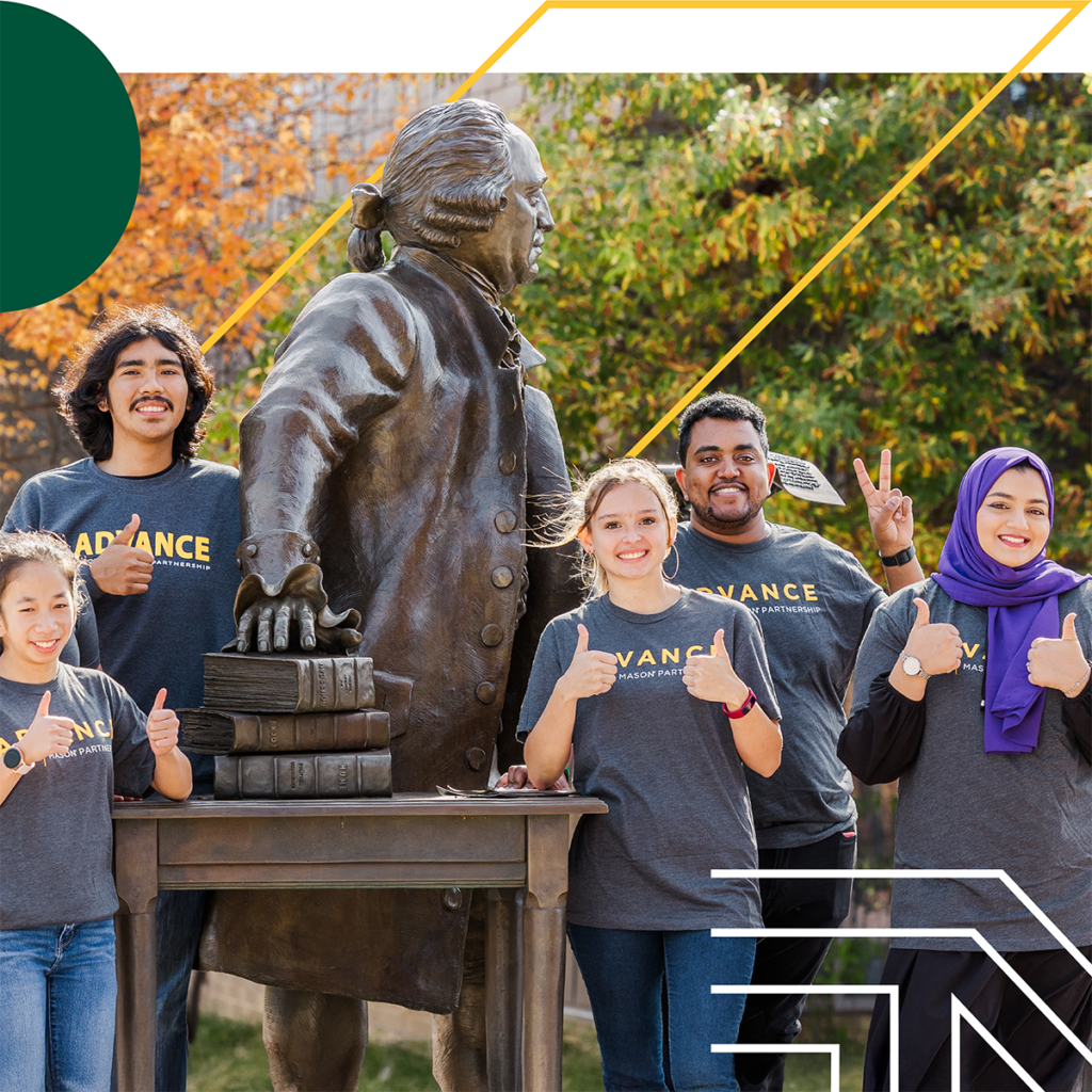A group of ADVANCE students standing by a statue on the George Mason University campus
