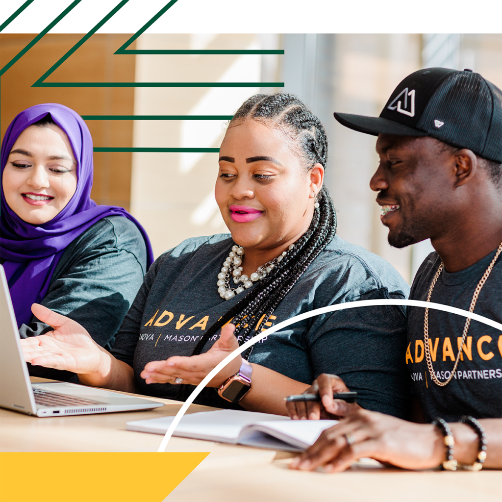 Three ADVANCE students sitting at a table with a laptop